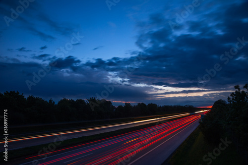 Night traffic scene with light trails on highway long exposure