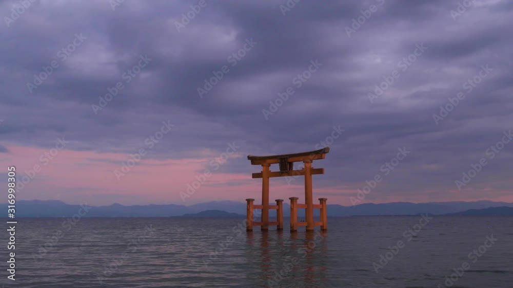 Sunset at Shirahige shrine torii gate, lake Biwa, Shiga Prefecture, Japan Sunset at Shirahige shrine torii gate, lake Biwa, Shiga Prefecture, Japan