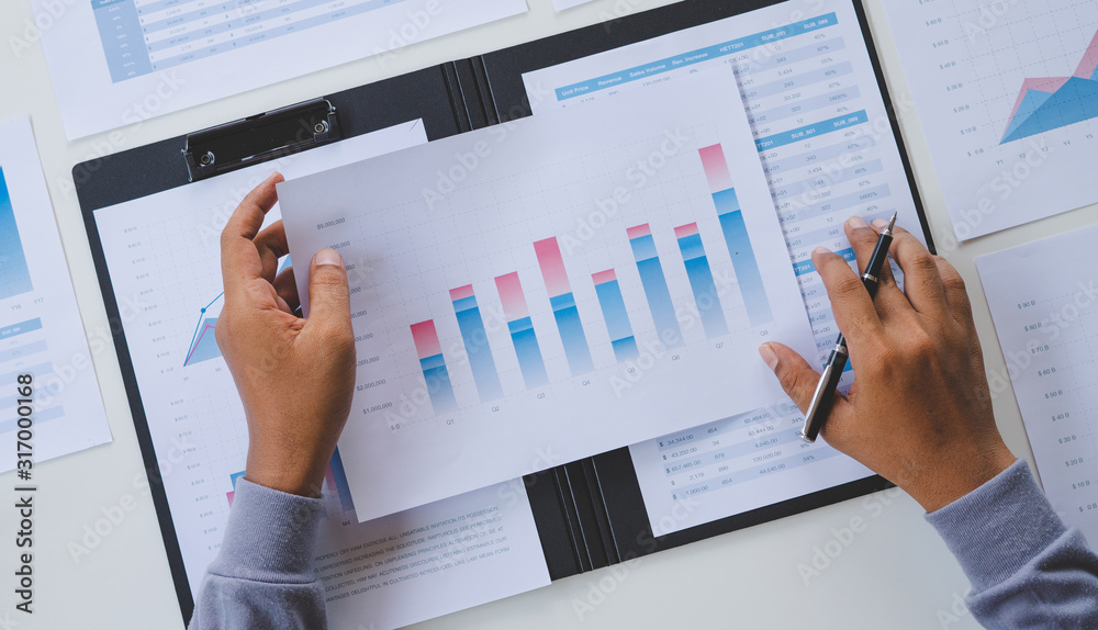 businessman working calculate data document graph chart report marketing research development  planning management strategy analysis financial accounting. Business office concept.