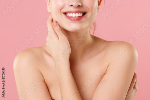 Close up cropped blonde half naked woman 20s perfect skin lips nude make up isolated on pastel pink wall background studio portrait. Skin care healthcare cosmetic procedures concept Mock up copy space
