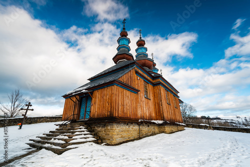 Exterior of Komancza Wooden Orthodox Church.  Bieszczady Architecture in Winter. Carpathia Region in Poland