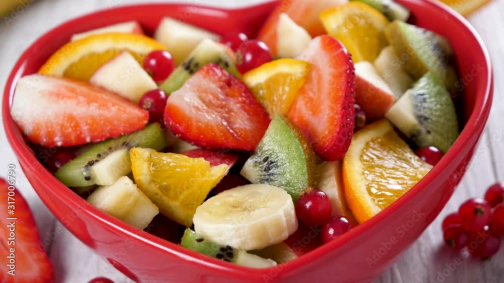 mixed fresh fruit salad with berries fruits, orange and orange mixed fresh fruit salad with berries fruits, orange and orange