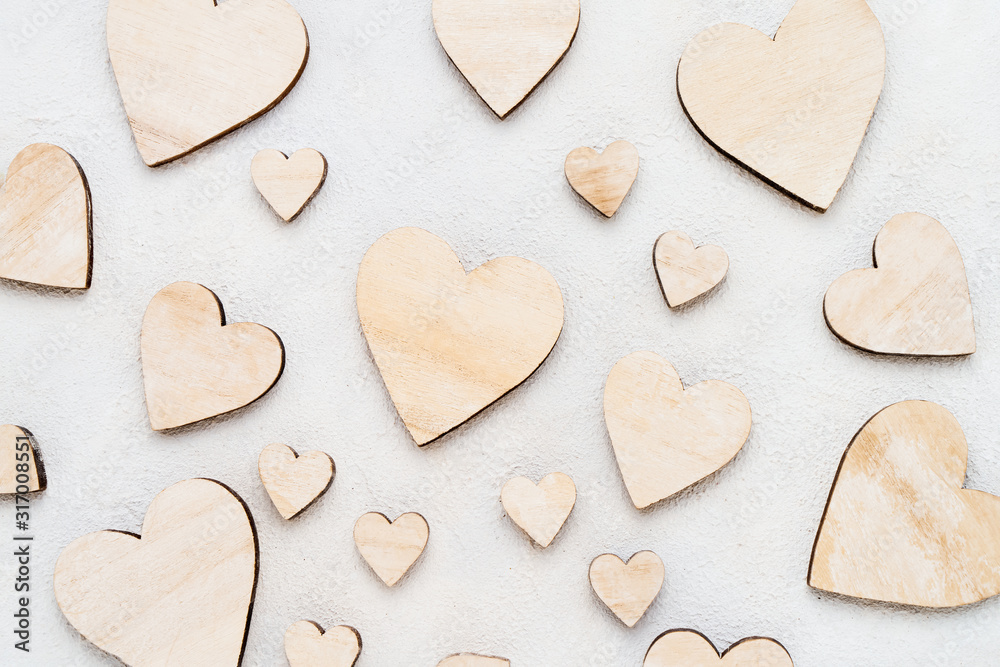 Valentines Day background with wooden hearts on a concrete background, top view. Valentines Day concept Valentines Day background with wooden hearts on a concrete background, top view. Valentines Day concept