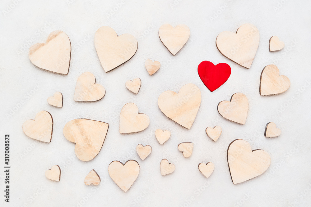 Valentines Day background with wooden hearts on a concrete background, top view. Valentines Day concept Valentines Day background with wooden hearts on a concrete background, top view. Valentines Day concept