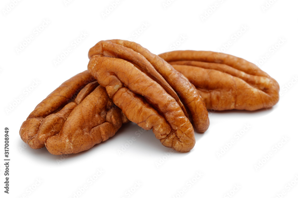 Peeled pecan nuts isolated on white
