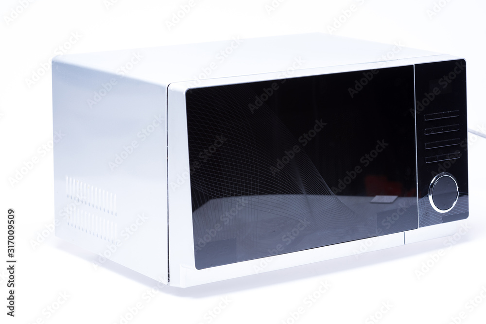 Fototapeta premium metal and electrical microwave oven on white background