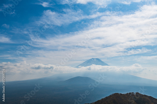 View of clouds over Mount Fuji and blue sky, Yamanashi Prefecture, Japan