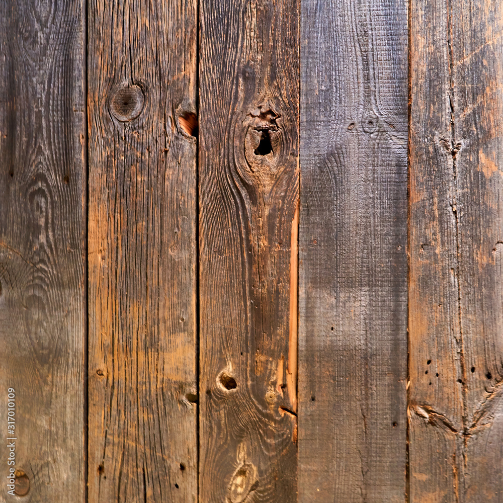 Old wooden boards with knotholes as a background. Old wooden boards with knotholes as a background.