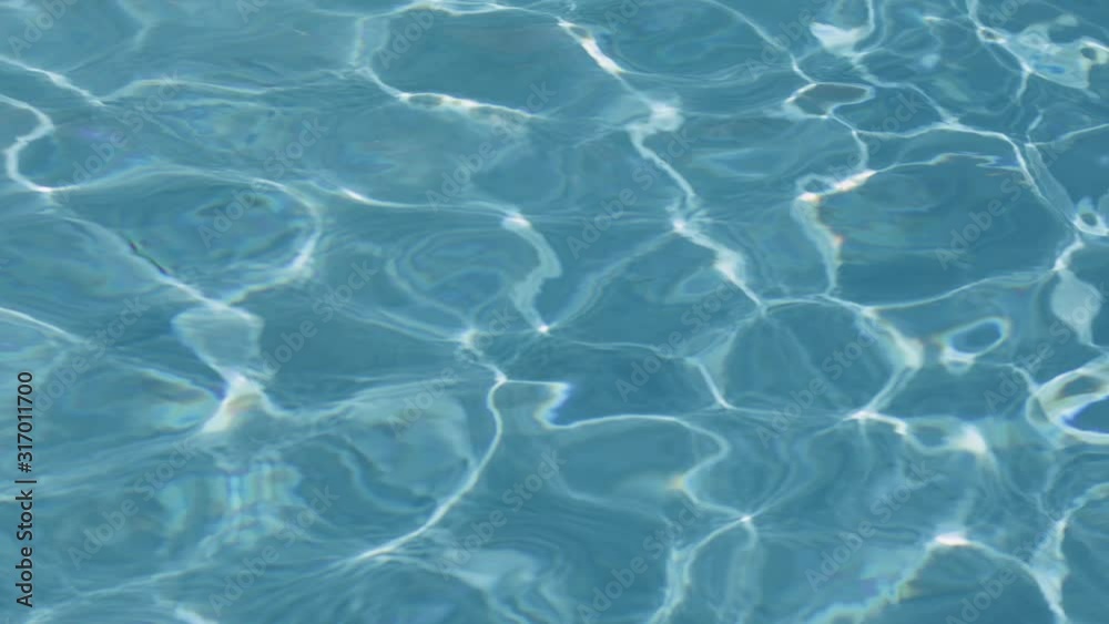 Pattern of blue water surface reflection swimming pool, Ripple wave and motion water for blue background and abstract, Bright and purified azure aquamarine turquoise water with sun reflection in pool Pattern of blue water surface reflection swimming pool, Ripple wave and motion water for blue background and abstract, Bright and purified azure aquamarine turquoise water with sun reflection in pool