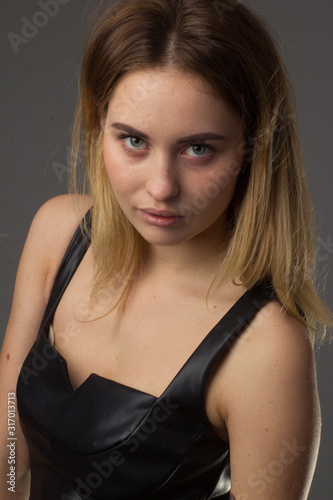 portrait of a young girl in a leather dress
