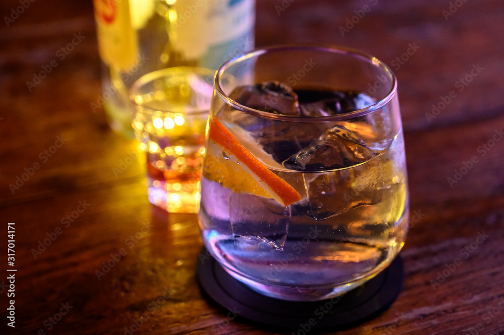 Glass of gin with tonic water, orange and ice Glass of gin with tonic water, orange and ice