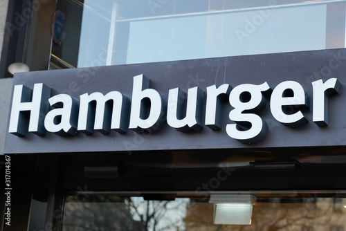 sign of street food hamburger text wall restaurant building on black background