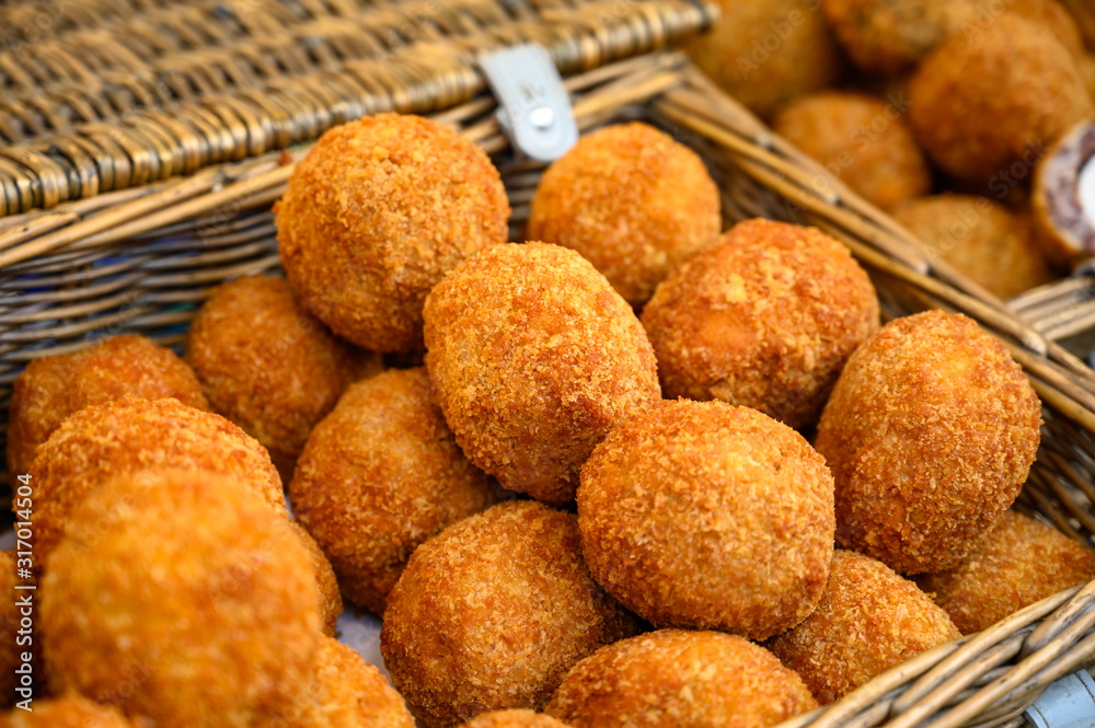 Traditional street food in UK, stuffed Scottish eggs with breadcrumbs Traditional street food in UK, stuffed Scottish eggs with breadcrumbs