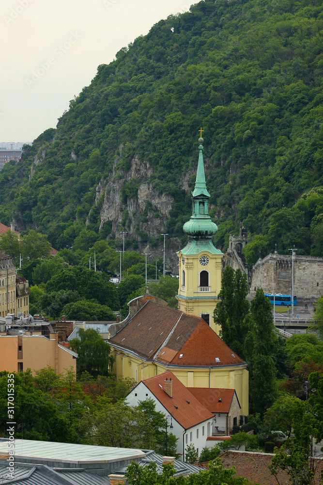 Yellow castle near a mountain