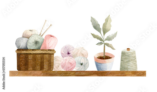 Hand painted watercolor winter cosy composition - brawn basket with yarn balls (wool) with needles and plant on a shelf. photo