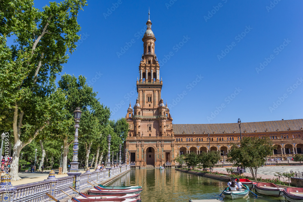 Rowing boats in front of the tower at Plaza Espana in Sevilla, Spain