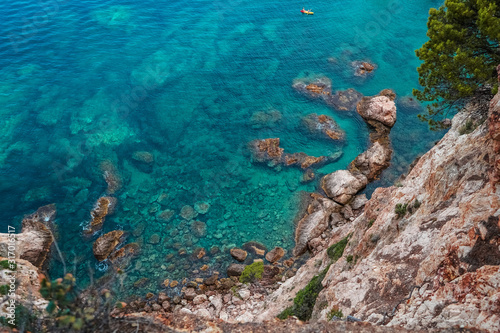 Top view of the turquoise Mediterranean sea and rocks