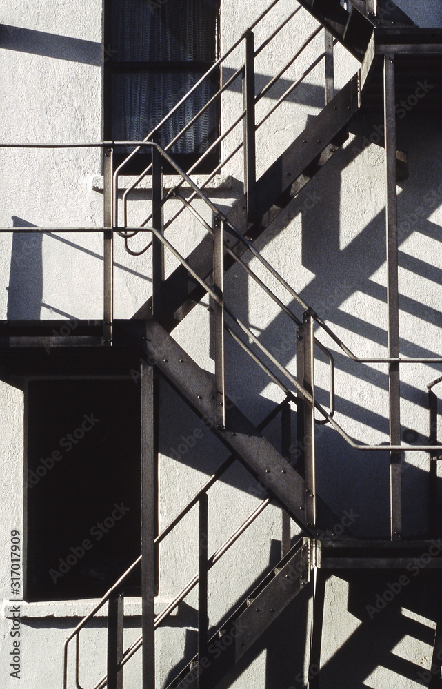 Naklejka premium staircase on building with shadows