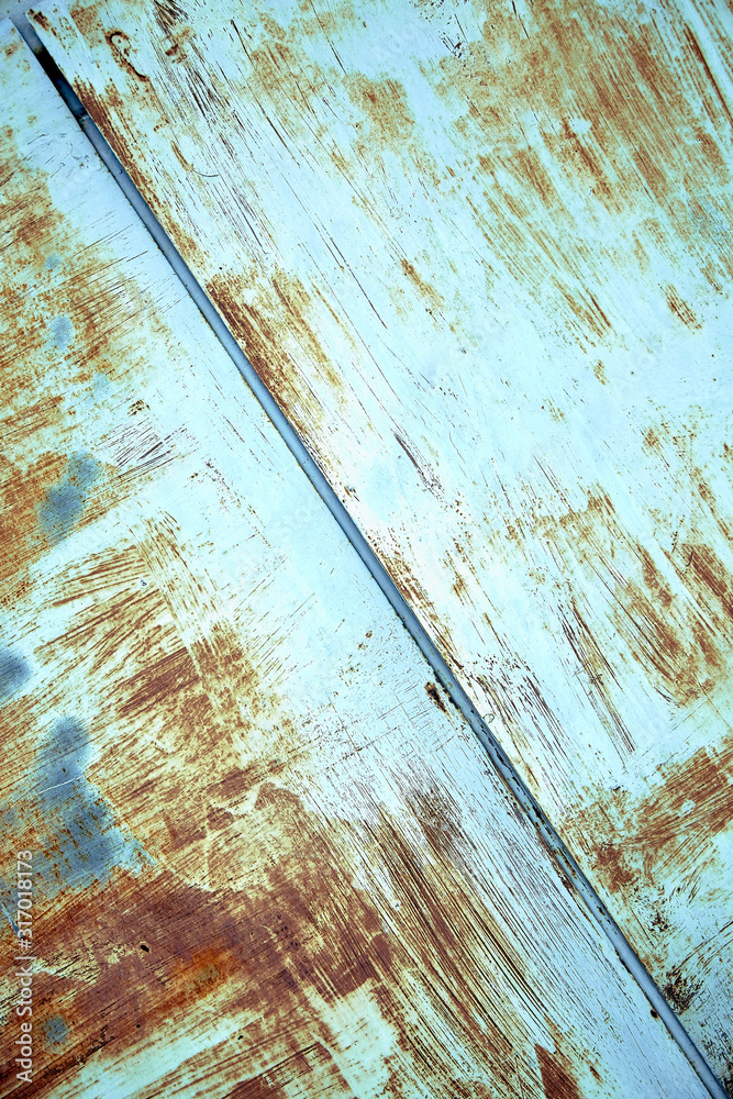Rust metal texture with peeling paint, blue color. Textural background, copy space, shot from above. text underlay.