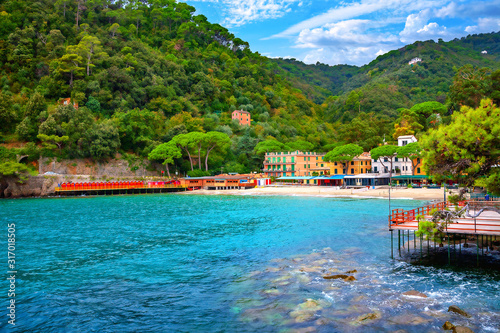 Beautiful beach with turquoise water in small bay. Portofino, Liguria, Italy