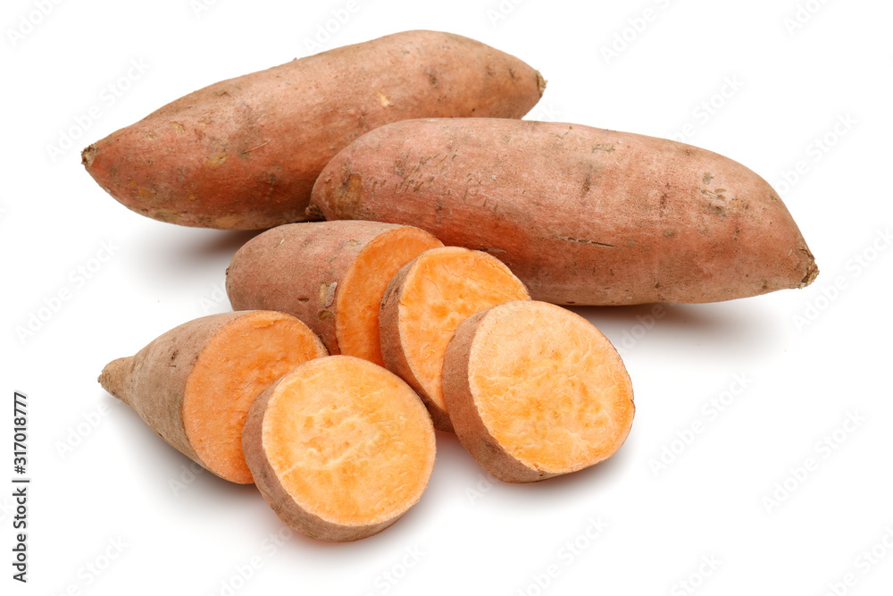 Sweet potatoes with slices isolated on white background Sweet potatoes with slices isolated on white background