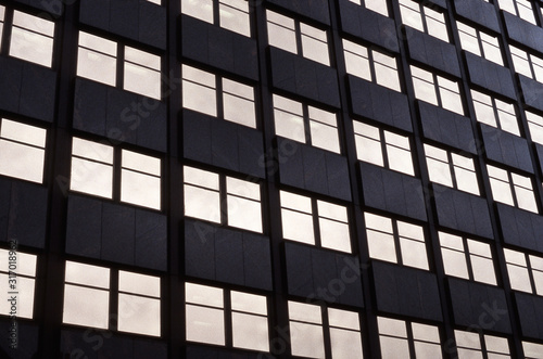 windows of office building with golden reflections
