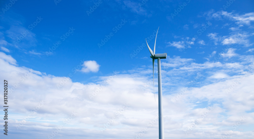 Wind turbine against beautiful blue sky with clouds. Eolic park. Wind turbine against beautiful blue sky with clouds. Eolic park.