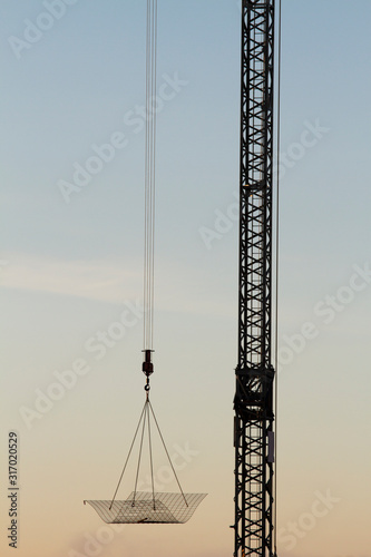 Detail of a construction crane with reinforcement mat