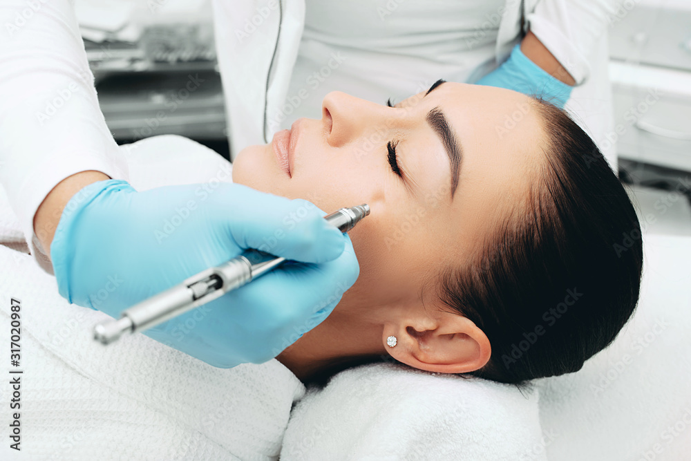 Jet peeling. Procedure renewing skin. Woman wants her skin to look young with with a cosmetic procedure Jet peeling. Procedure renewing skin. Woman wants her skin to look young with with a cosmetic procedure