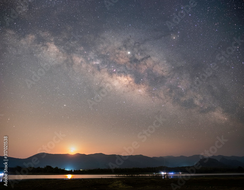 At night have stars, milky way and galaxies filled the dark sky.