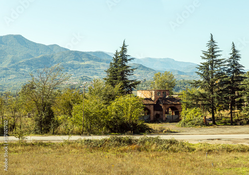 View  from the road to the ruined old building in the forest in Imereti in Georgia
