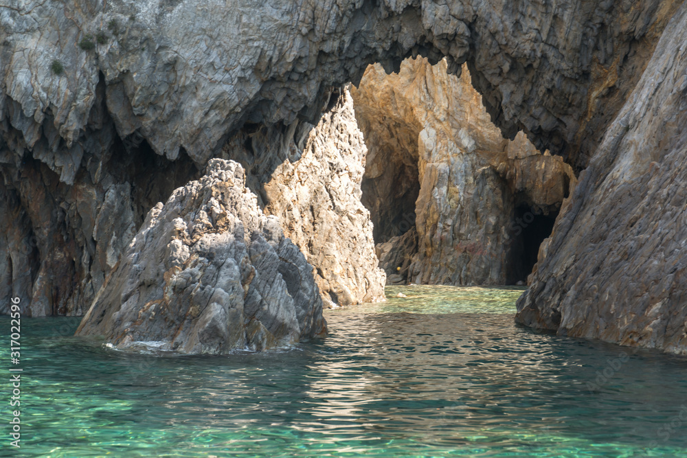 Sea caves on blue water near Ponza, in the Italian Mediterranea sea