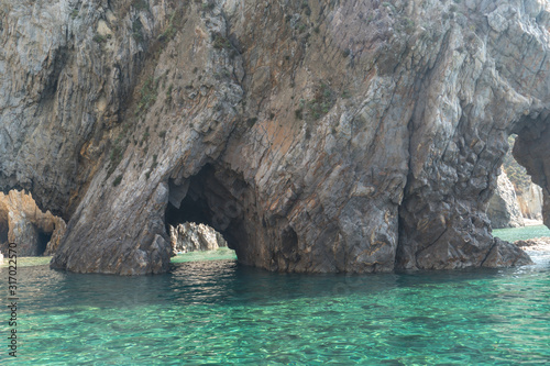 Sea caves on blue water near Ponza, in the Italian Mediterranea sea