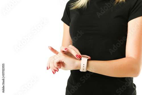 smart watch on a female hand close up on white background with copy space