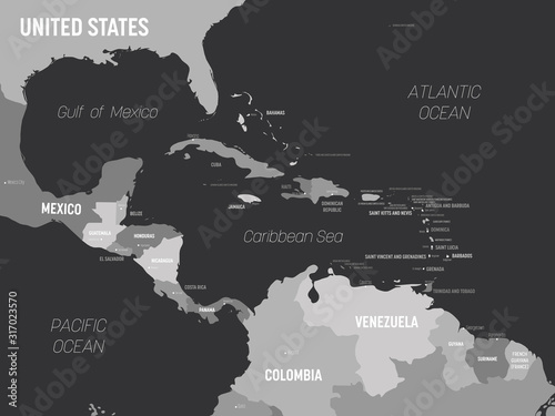 Central America map - grey colored on dark background. High detailed political map Central American and Caribbean region with country, capital, ocean and sea names labeling