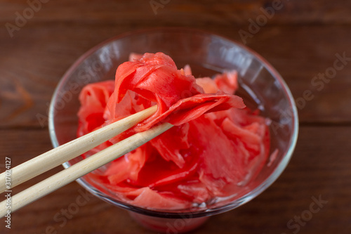 Pickled ginger with wooden sticks.