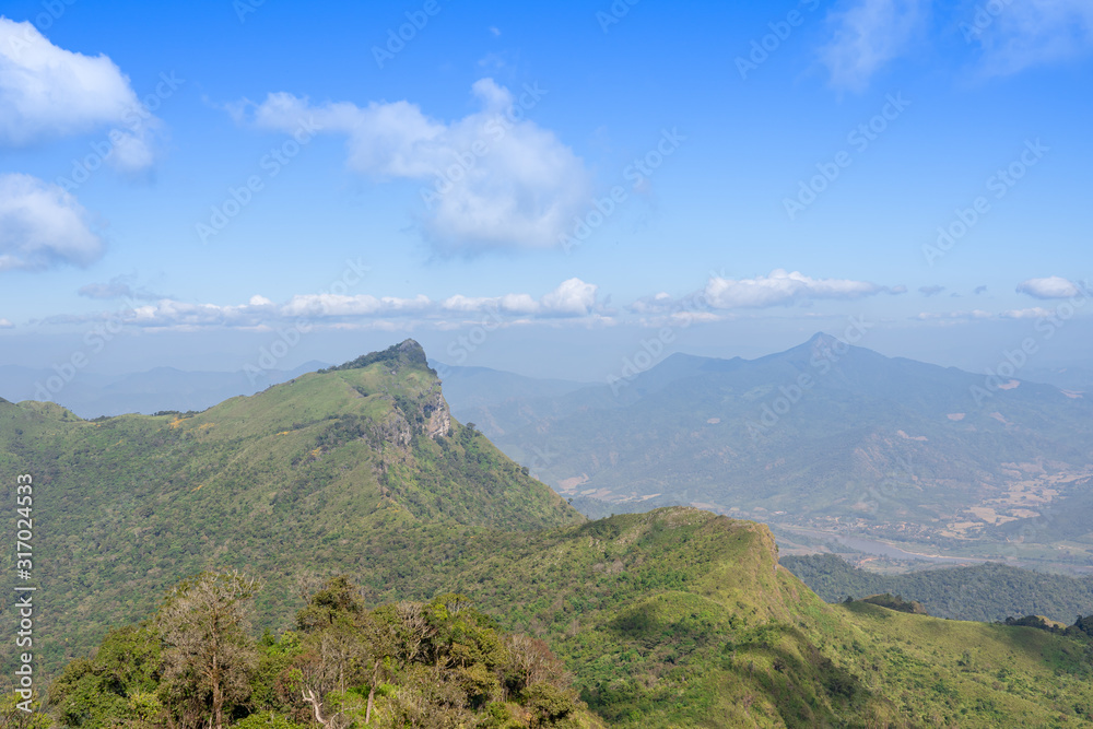 Landscape of mountain with green grass field and clear blue sky Landscape of mountain with green grass field and clear blue sky