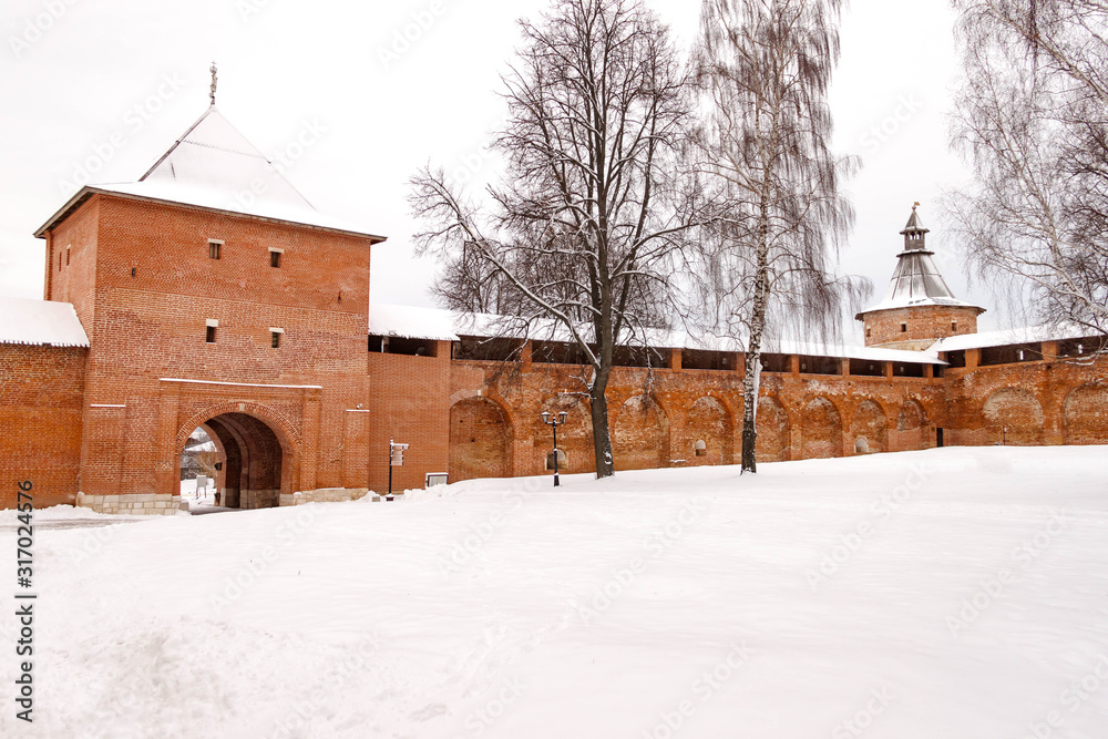 Zaraysk Kremlin walls and towers at winter day. Russia, Moscow region. Fortress walls and Sentry Corner Tower inner territory. Natural background winter view.