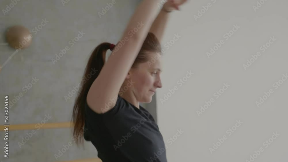 Girl does sports exercises in the hall close-up Girl does sports exercises in the hall close-up