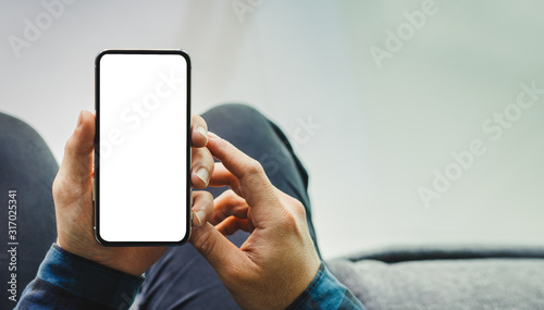 Mockup image blank white screen cell phone.man hand holding texting using mobile.background empty space for advertise text.people contact marketing business,technology 