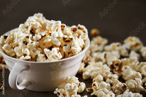 Popcorn in cup on black background 