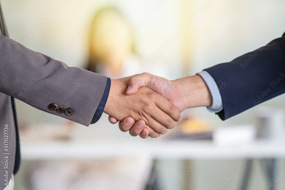 Closeup of businessmen shaking hands