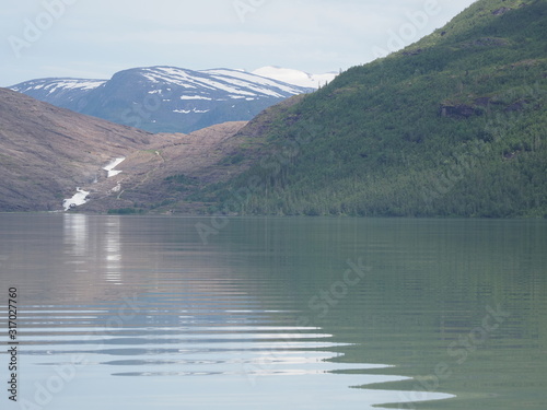 Svartisvatnet lake and waterfall near Svartisen glacier in Norway photo