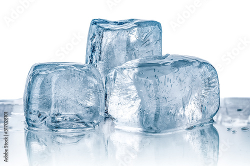 Melting ice cubes close up on white background