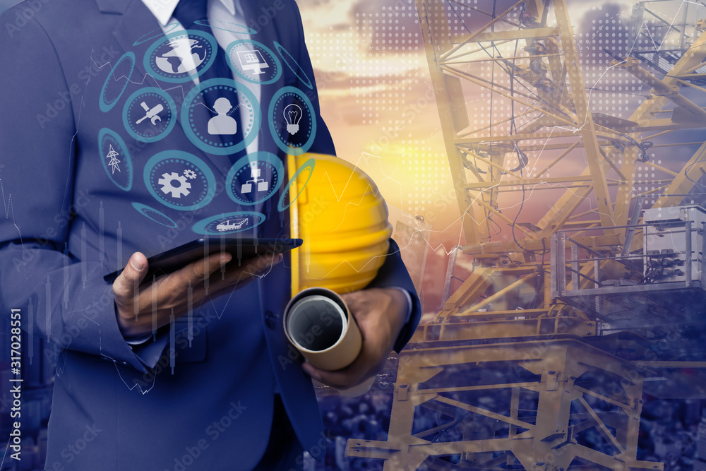 Fototapeta premium Double exposure engineering using digital technology interfaces icon with construction cranes no city background.