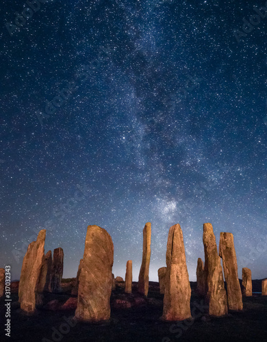 Nightview of Stones of Callanish, stone circles arranged like the Stonehenge in Great Britain, at the Loch Roag, Isle of Lewis, Scotland, UK photo