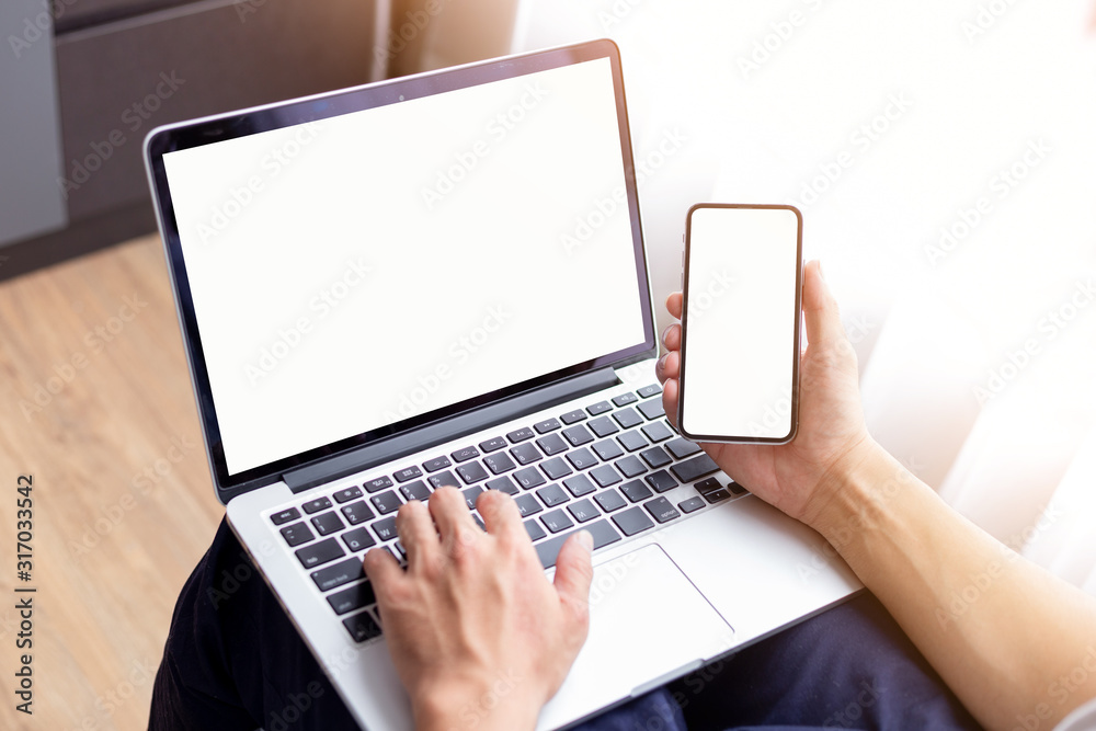 mockup image blank screen computer,cell phone with white background for advertising text,hand woman using laptop texting mobile contact business search information on desk in cafe.marketing,design mockup image blank screen computer,cell phone with white background for advertising text,hand woman using laptop texting mobile contact business search information on desk in cafe.marketing,design