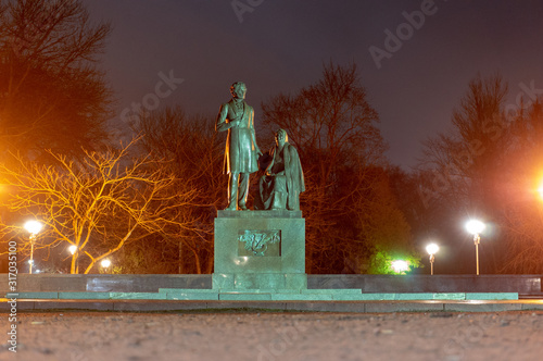 Pskov, Russian Federation. Monument to russian poet Alexander Pushkin and his nanny Arina Rodionovna in the park of Pskov, Russia photo