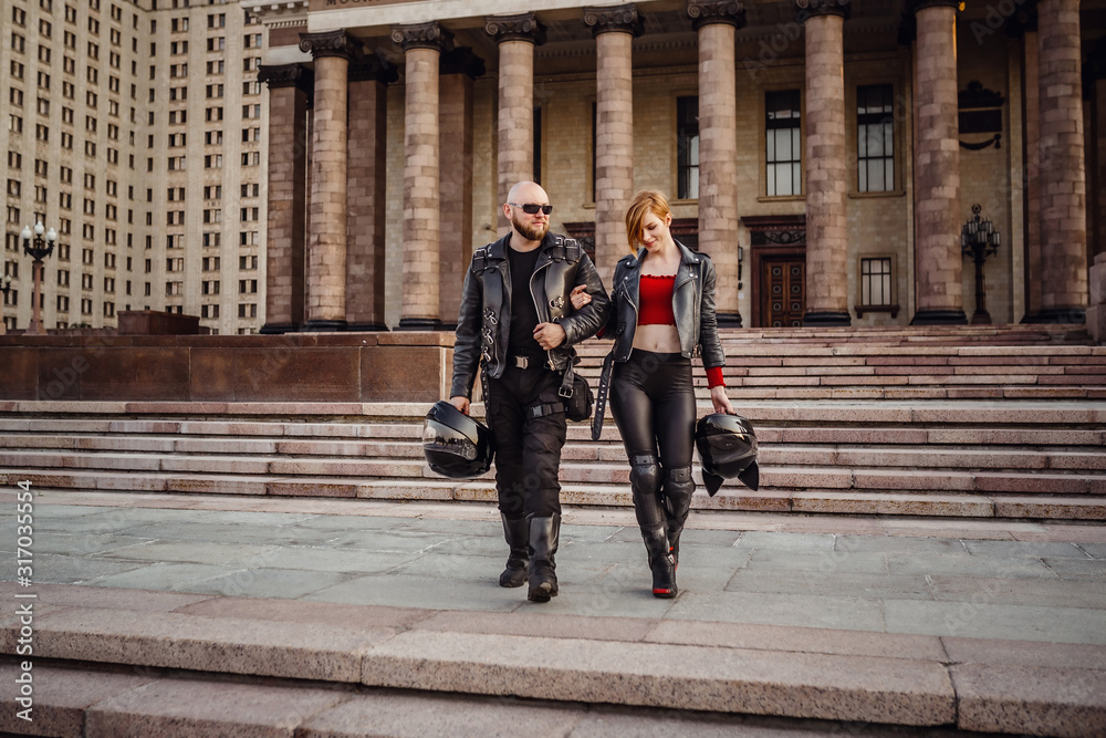 Beautiful couple on a cool motorcycle against Moscow Beautiful couple on a cool motorcycle against Moscow
