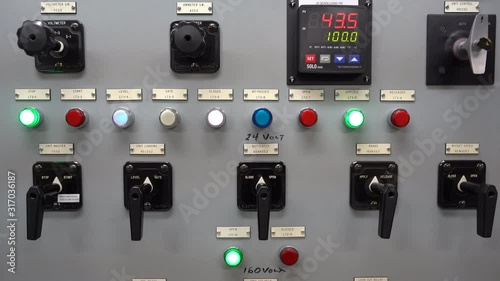 Buttons and switches on a power generation control panel photo